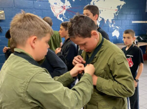 Read more about the article A Coy Holds Buttons and Ties Competition